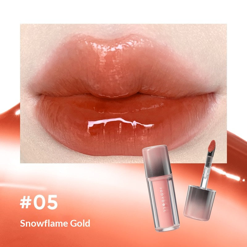 Judydoll Ice Glow Watery Lip Gloss #05 Dawn To It featuring soft peach nude glossy lip color with watery glow